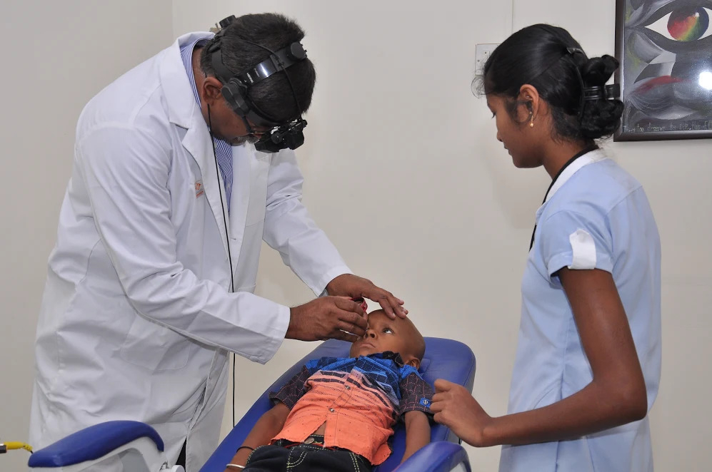 Eye doctor examining a patient's eyes